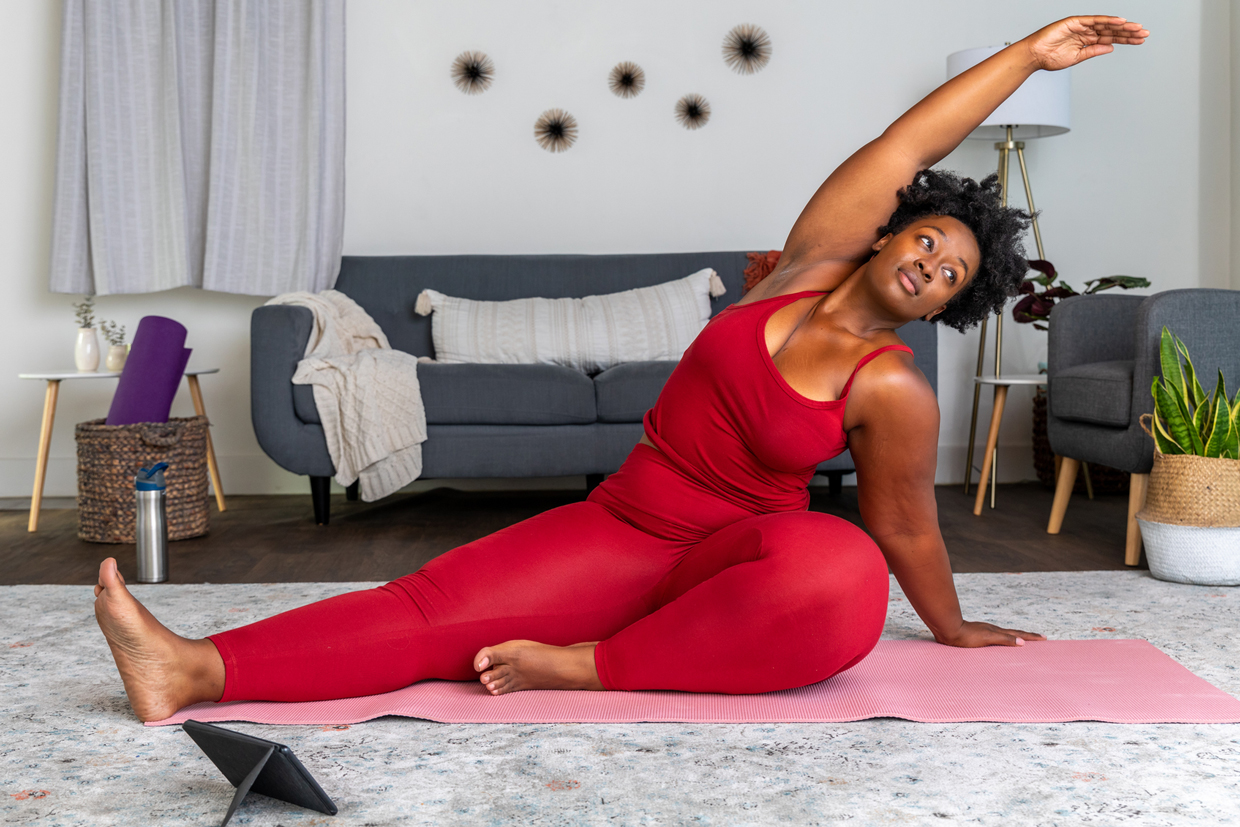 Woman Does Yoga Stretch On Her Yoga Mat