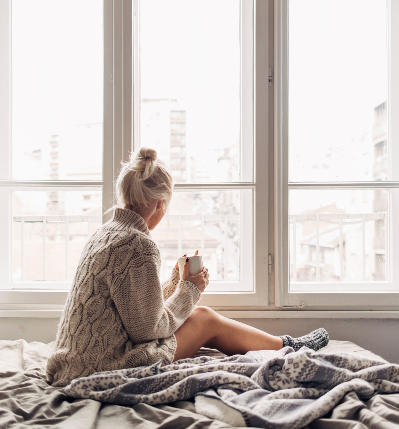 Blonde Woman Drinking Morning Coffee in Bed