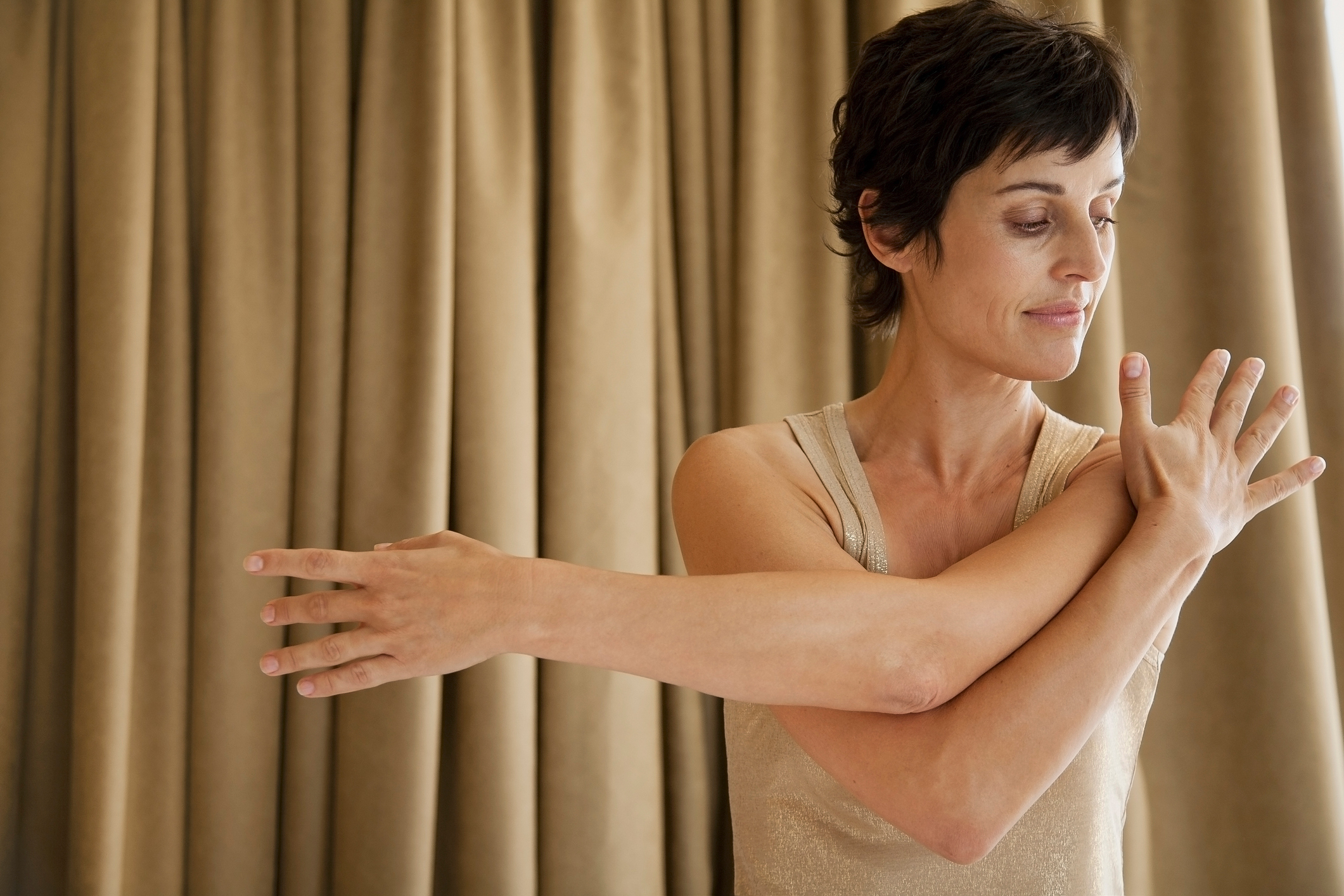 woman stretching shoulder