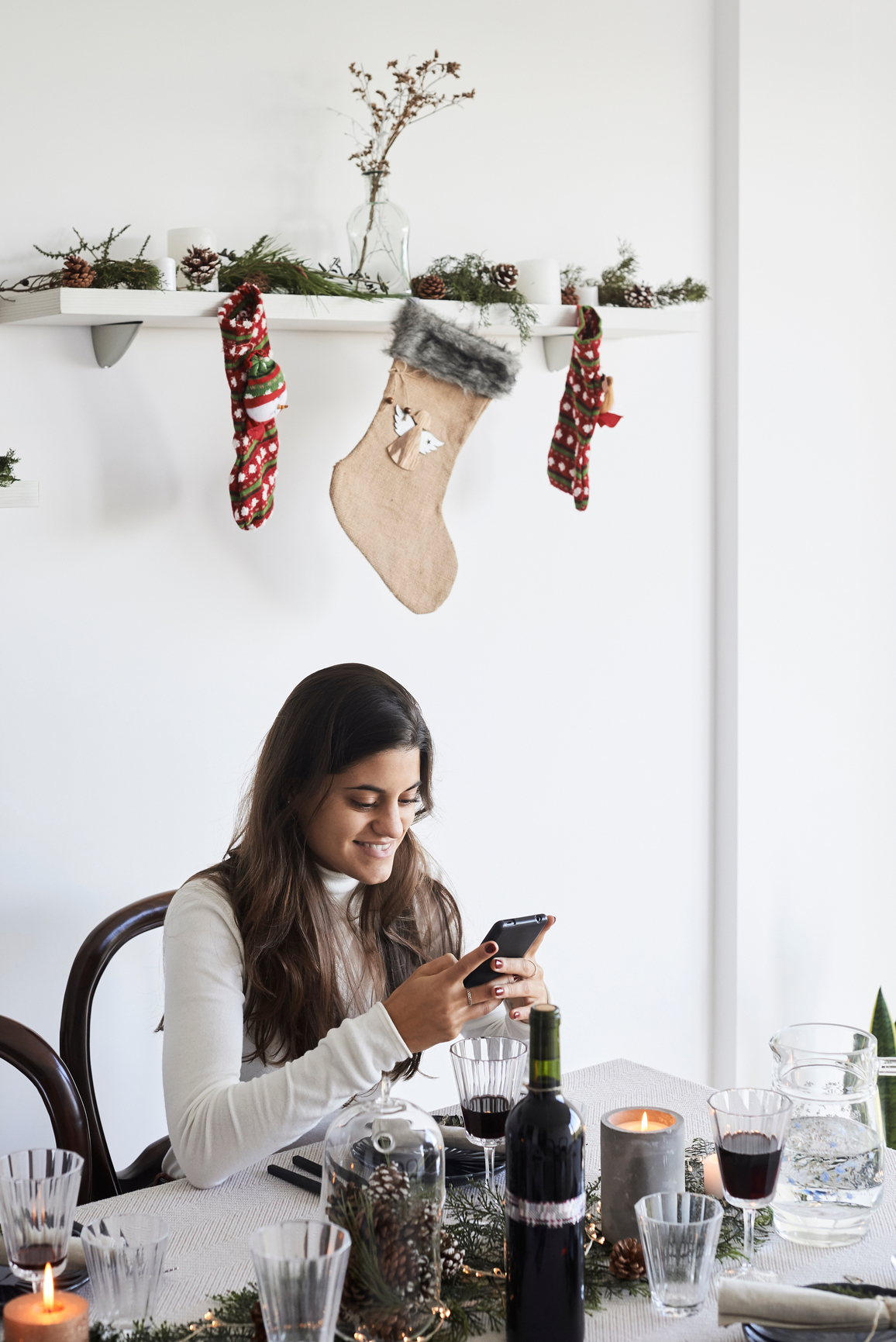 Diner using smartphone christmas