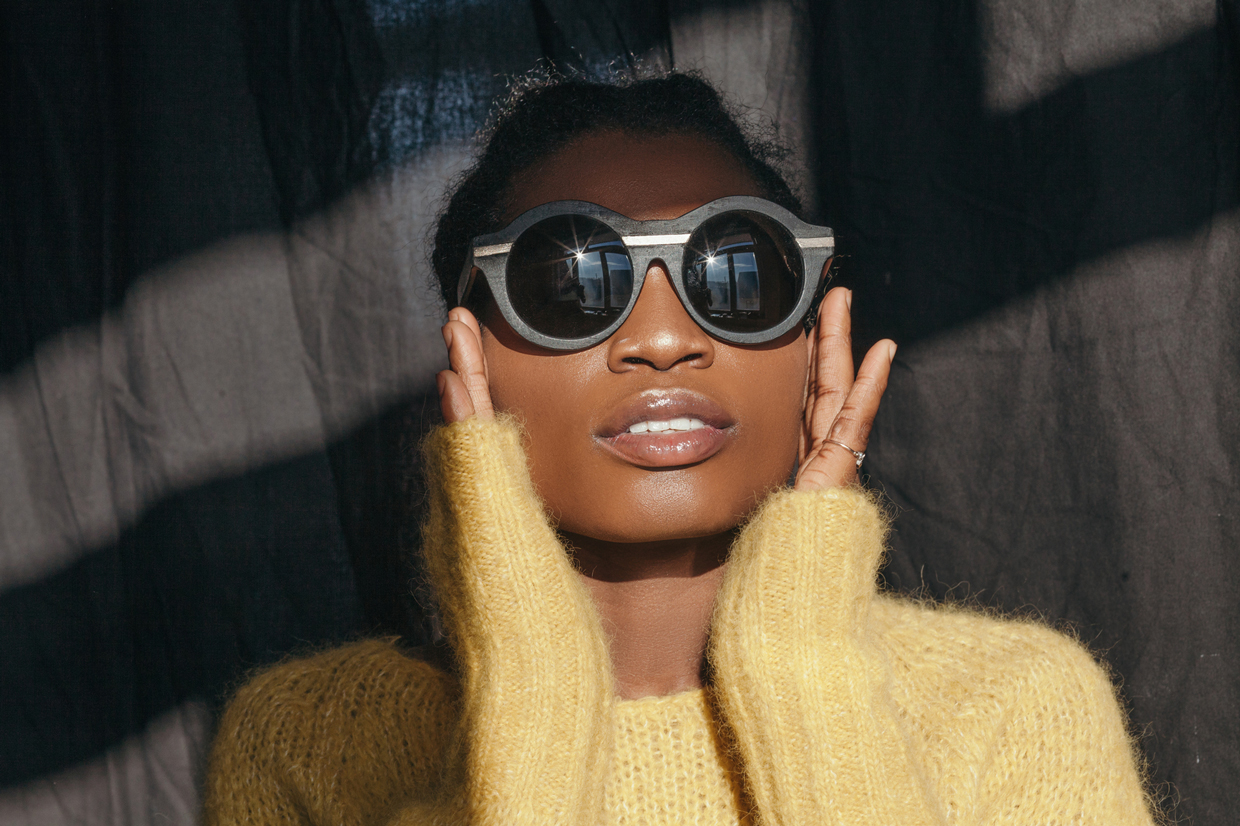 woman with sweater wearing sunglasses