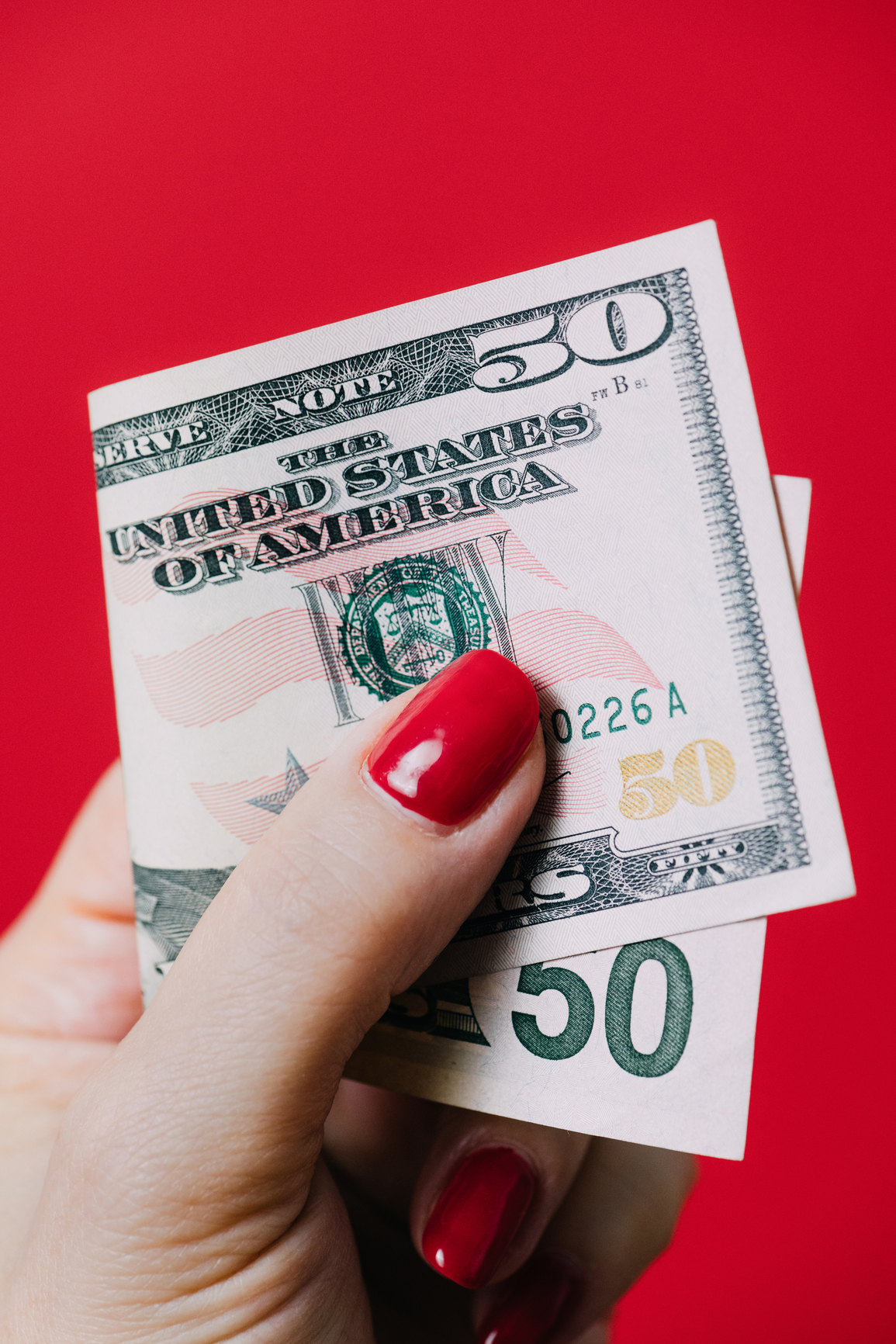 Hand holding money