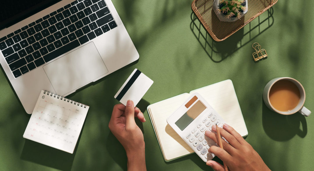 person using mock up credit card and mobile cell phone