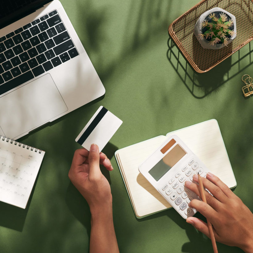 person using mock up credit card and mobile cell phone