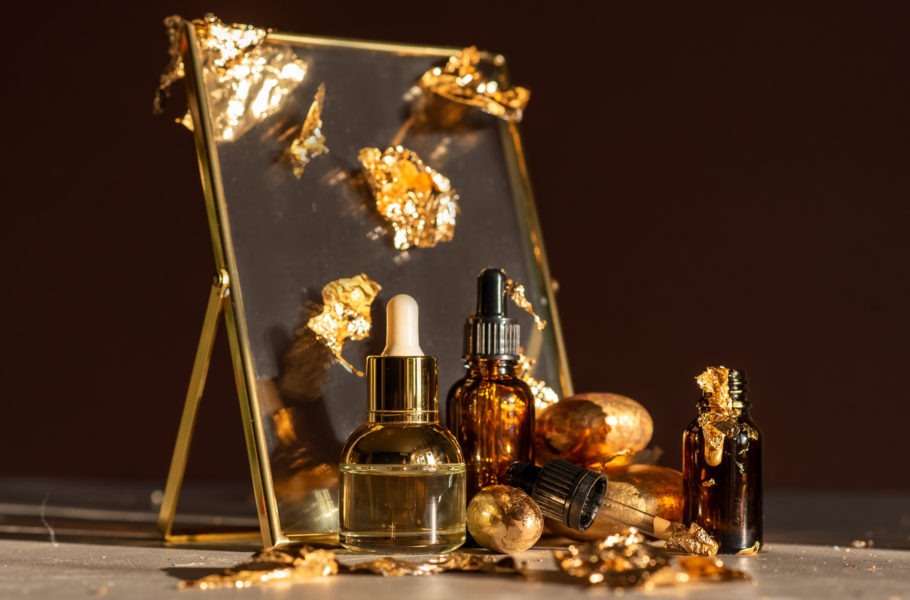 gold skincare products still life