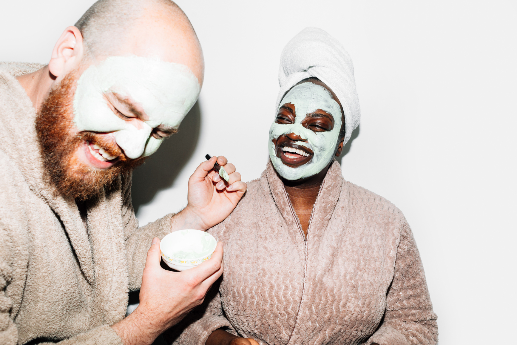 couple doing self care face masks