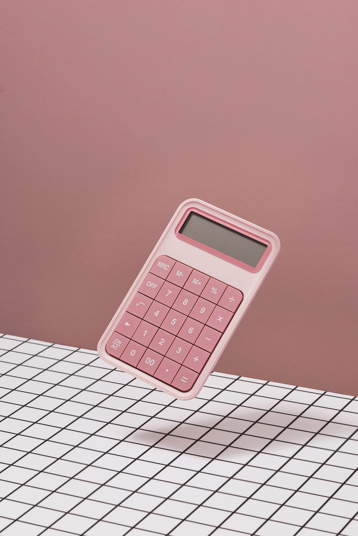 pink calculator on pink background