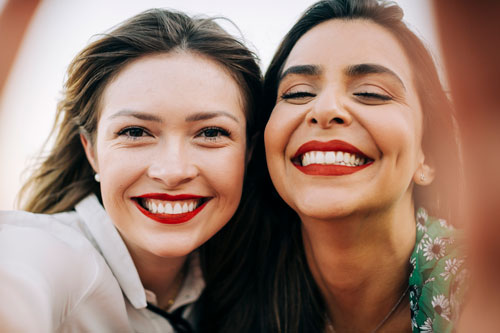 Close-up portrait of smiling female friends