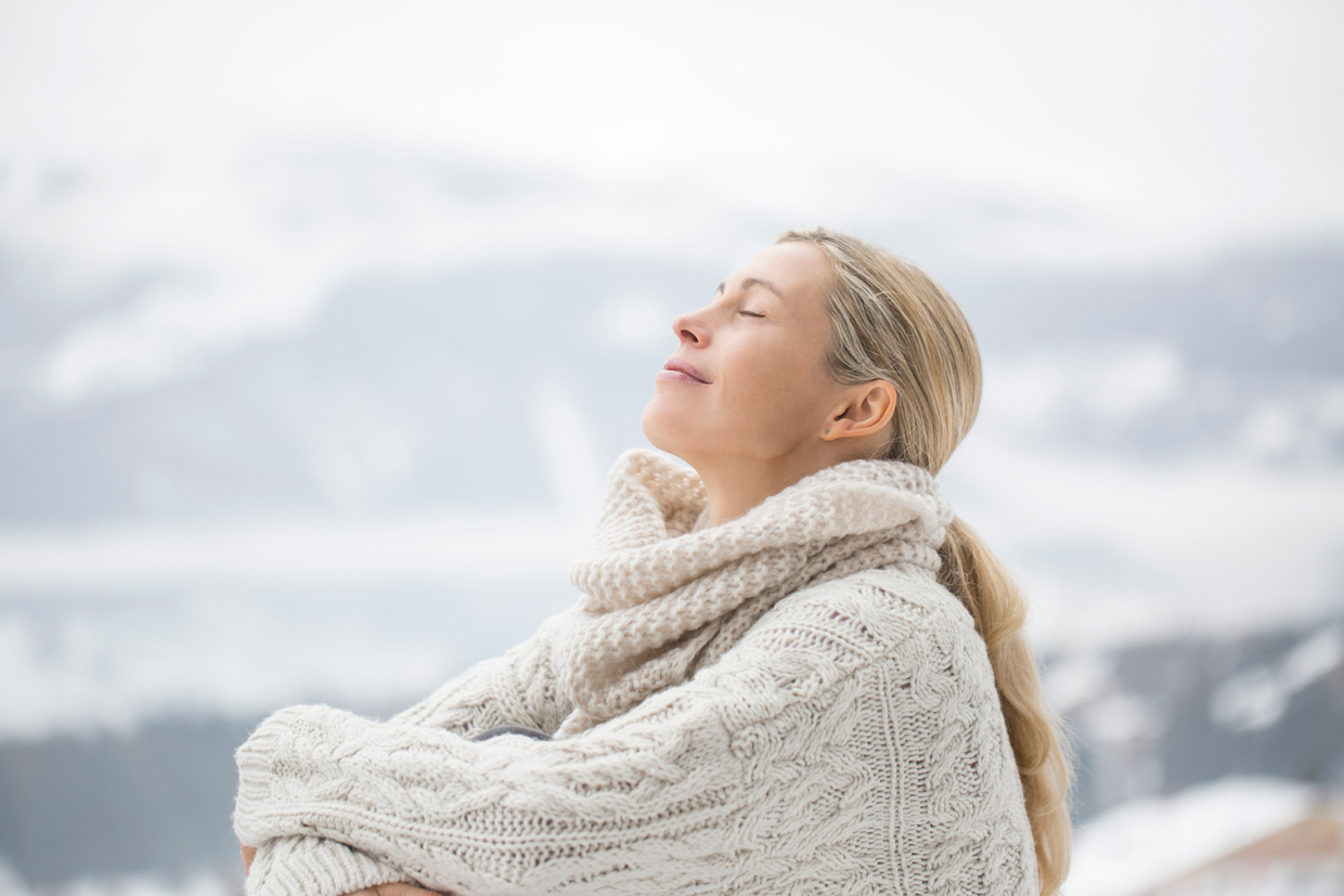 Close-up of a woman sitting with her eyes closed, Crans-Montana, Swiss Alps, Switzerland