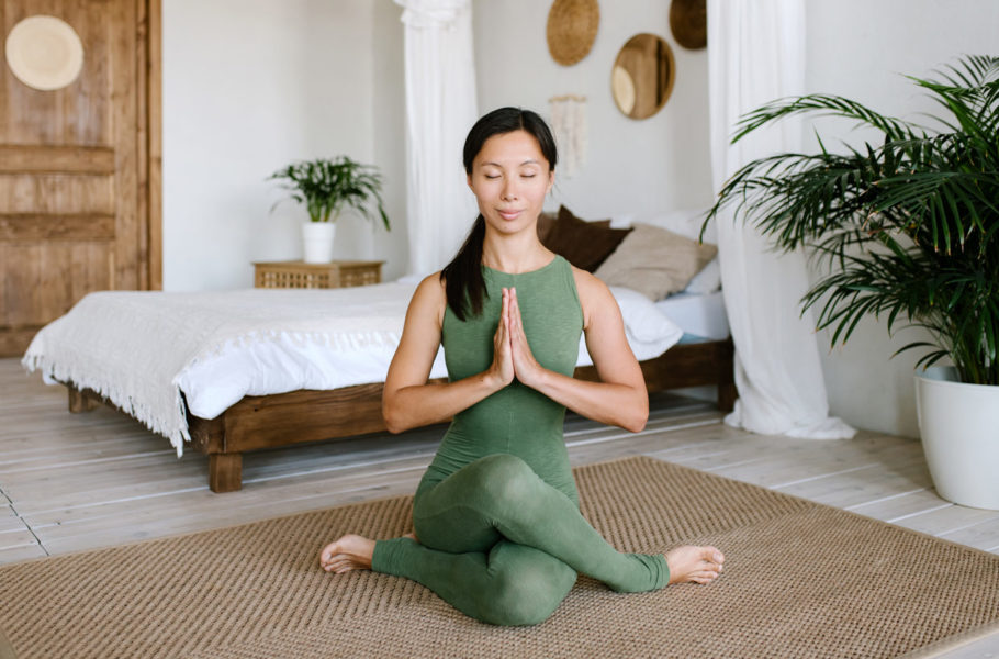 woman doing yoga at home