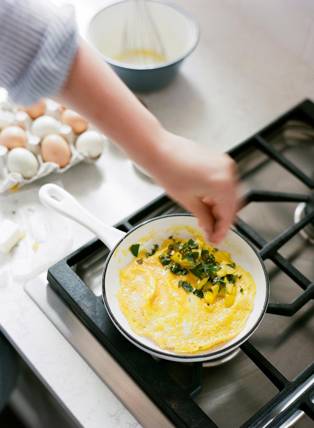 woman preparing omelette