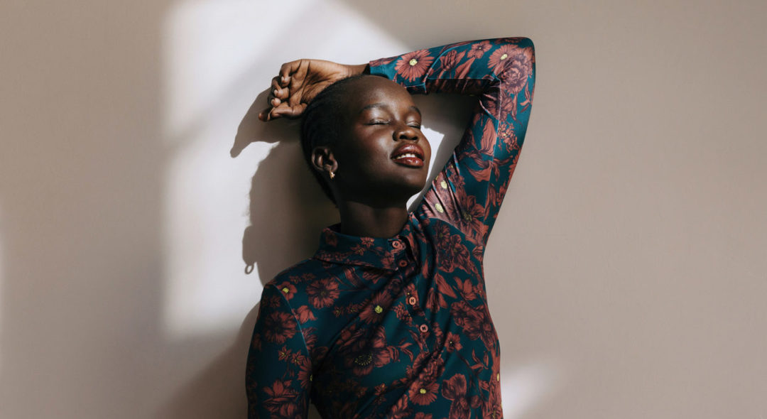 woman in room with sun in her face