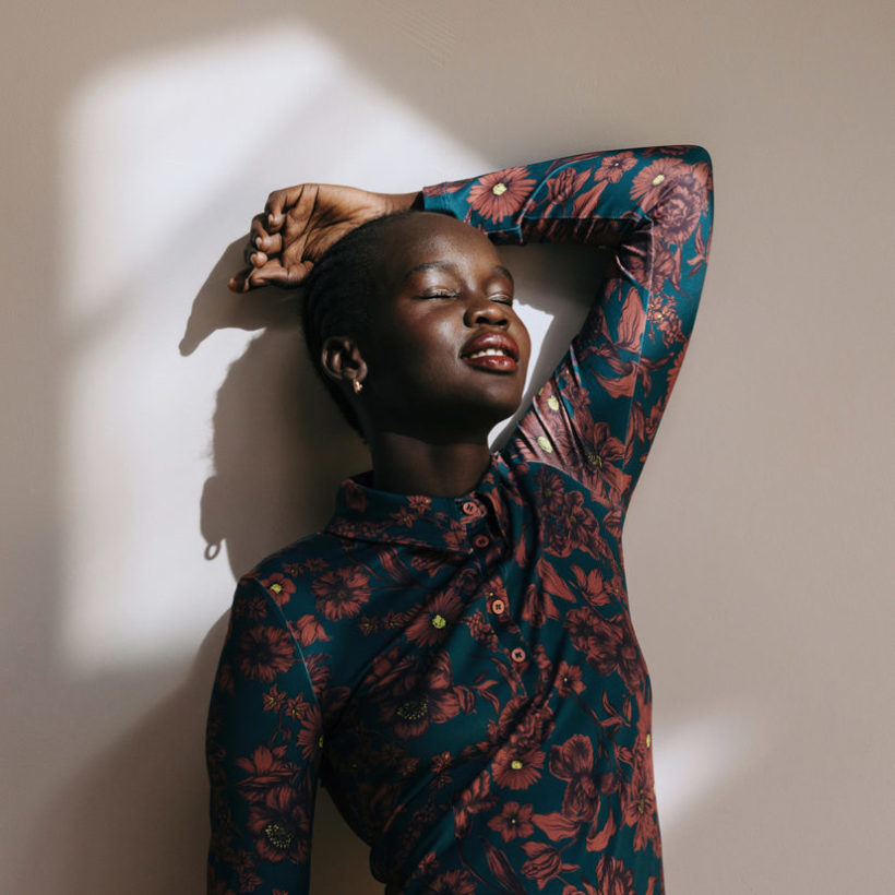 woman in room with sun in her face