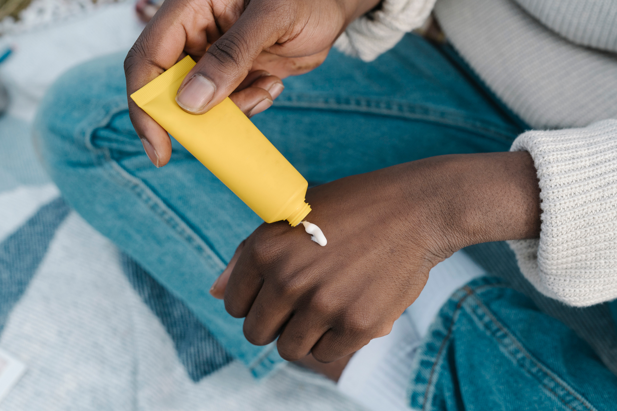 person applying hand lotion