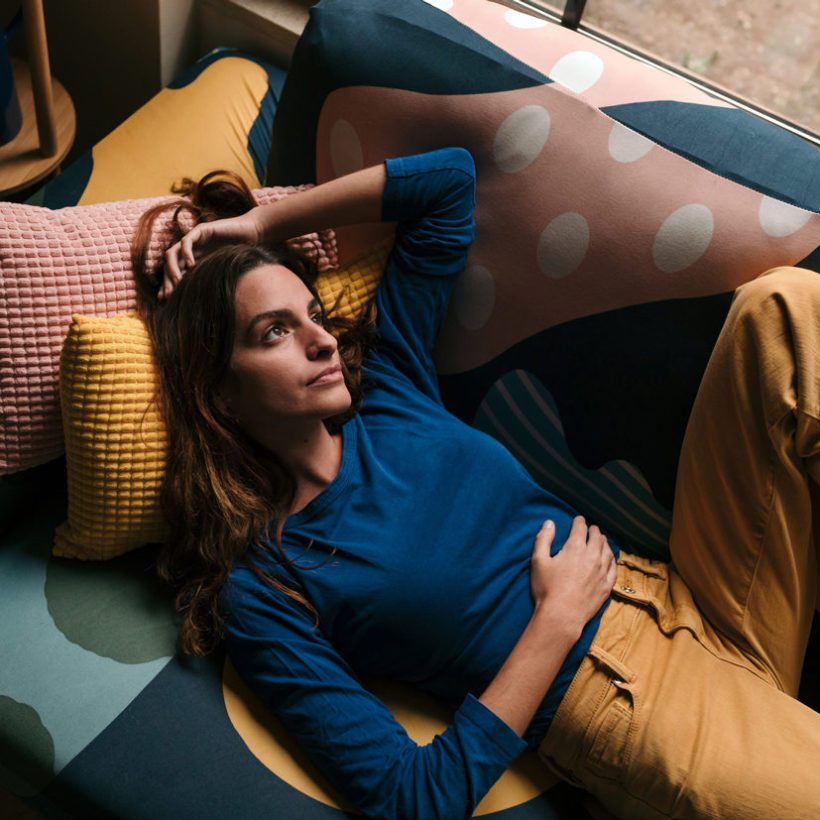 pensive woman on couch