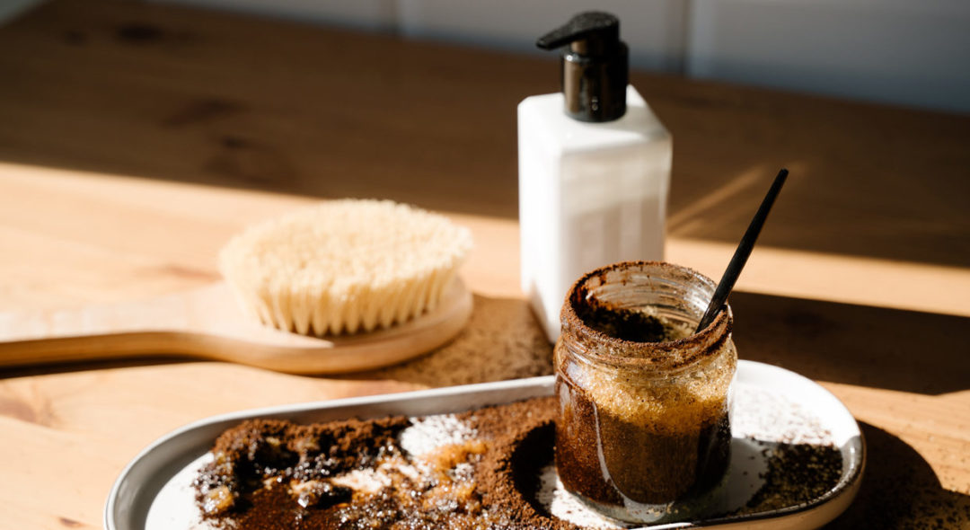 still life of coffee scrub, dry brush and skincare