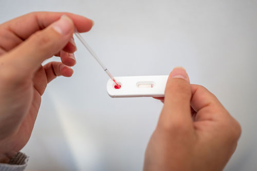 woman taking an at home health test