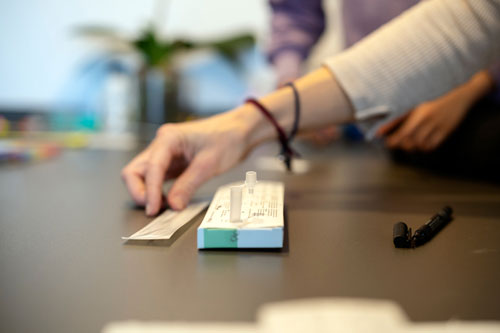 woman taking an at home health test