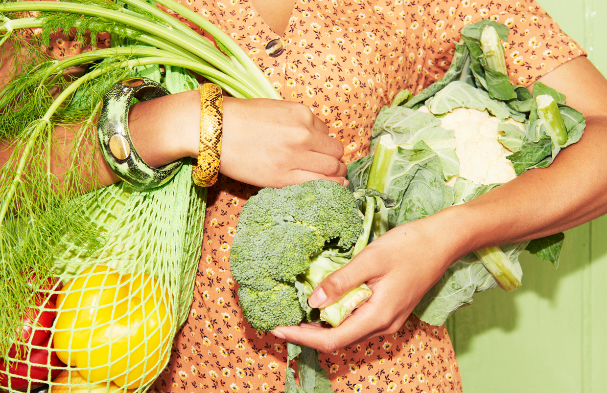 woman holding vegetables