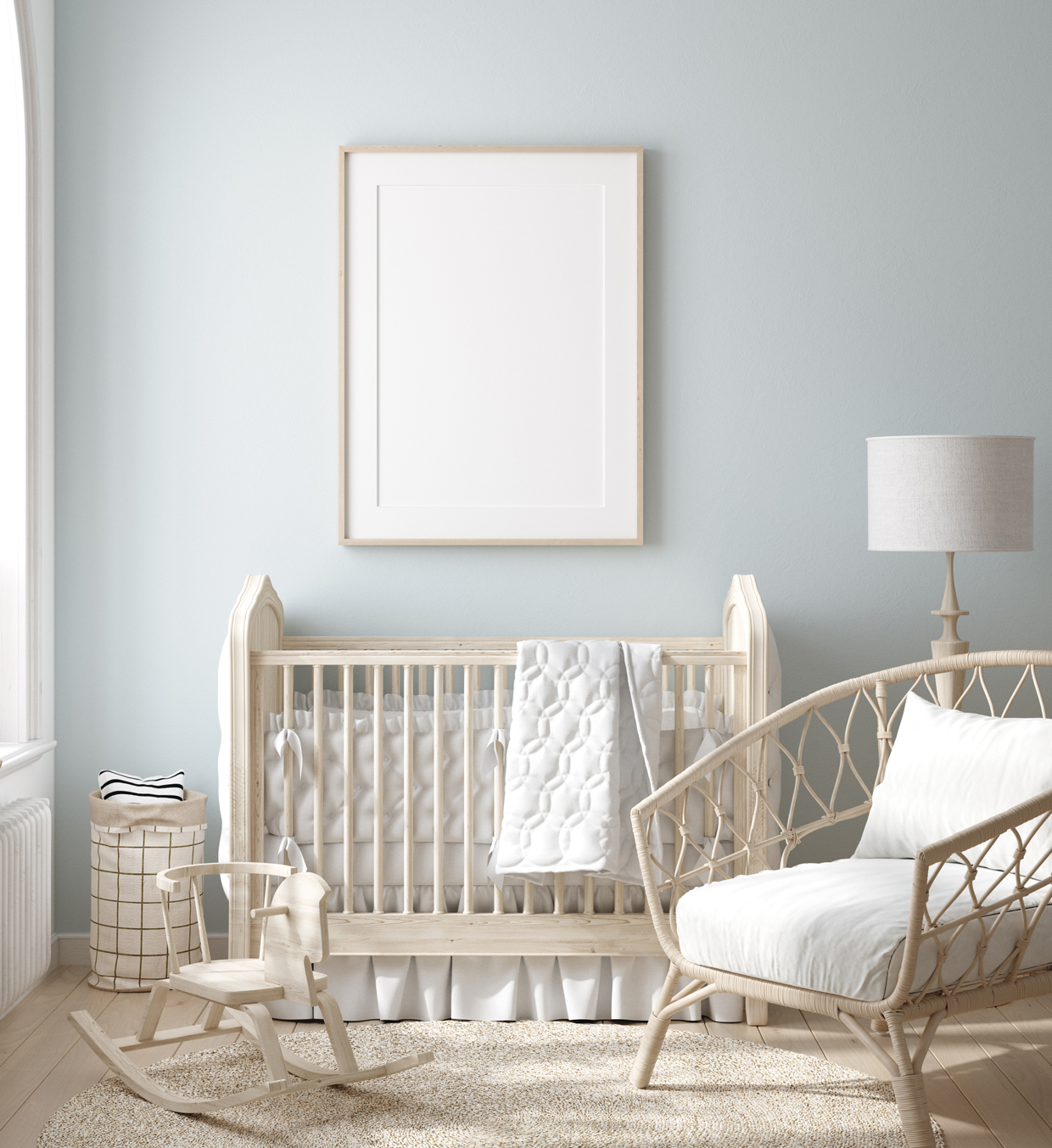 frame in nursery with natural wooden furniture