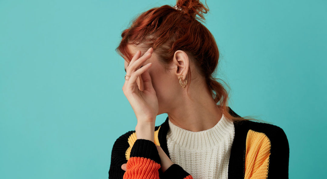 woman covering face