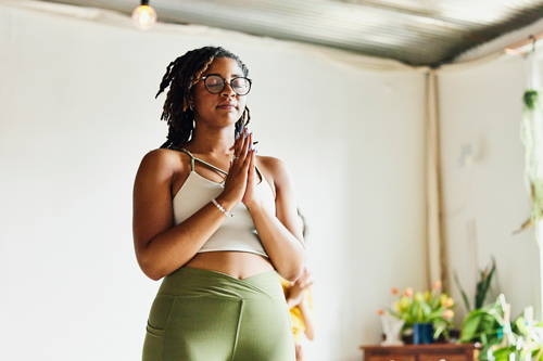 woman relaxing after finishing yoga