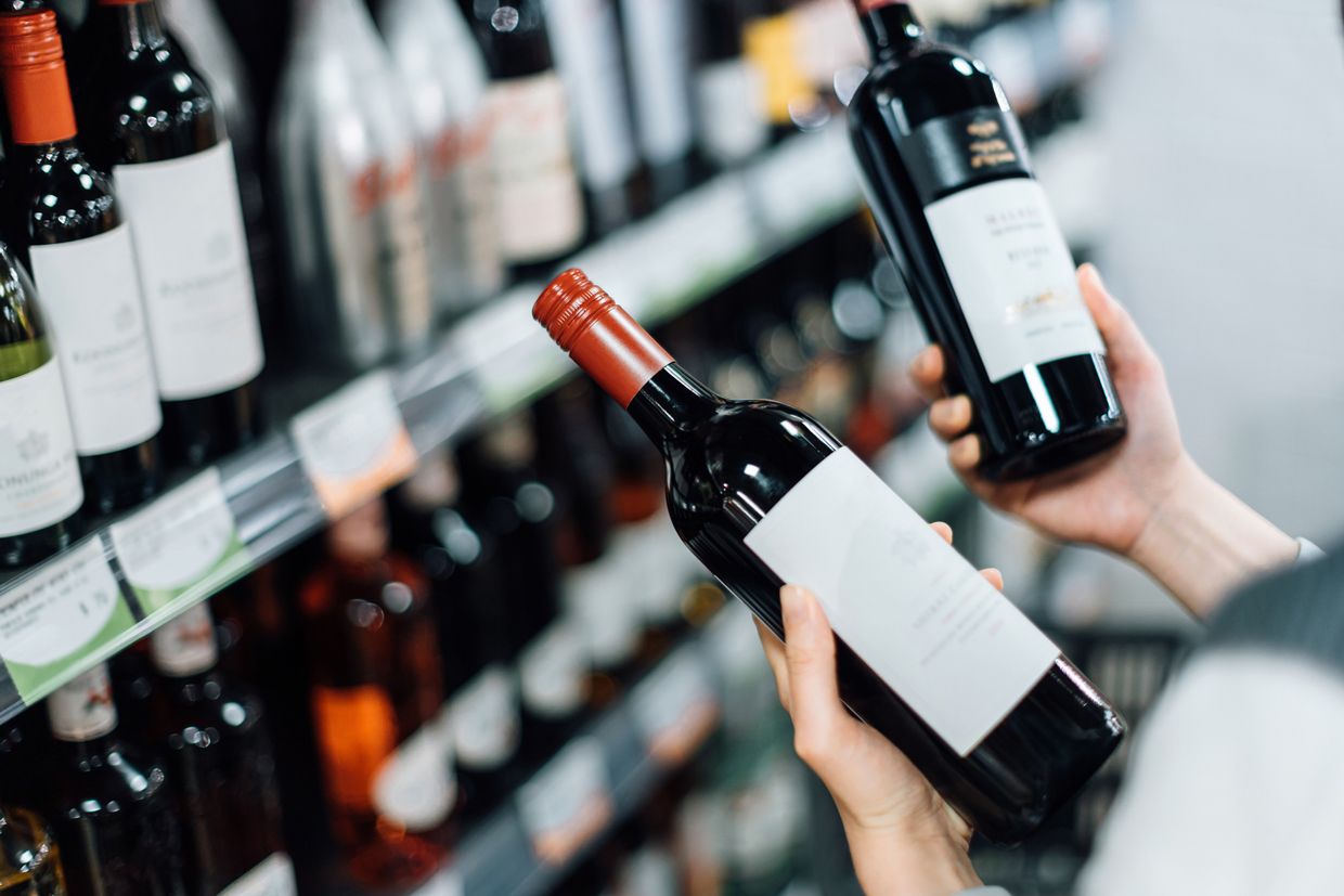 overhead shot of person choosing wine