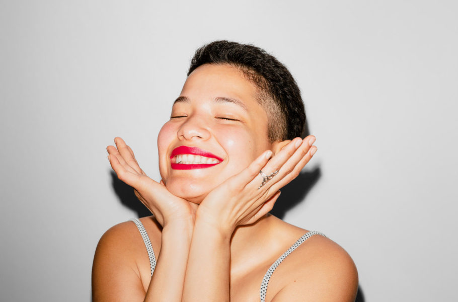Woman smiling with her eyes closed