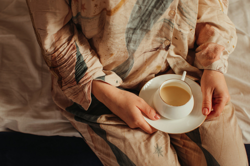 woman holding coffee cup