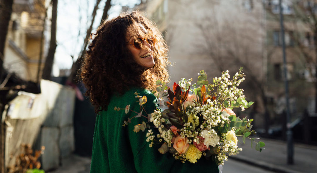 Woman Walking With Flower Bouquet