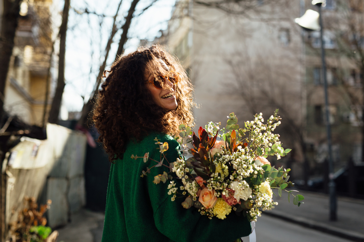Woman Walking With Flower Bouquet