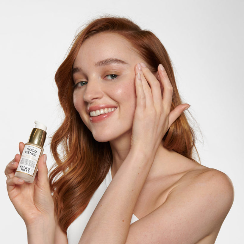 Phoebe Dynevor portrait holding good genes serum