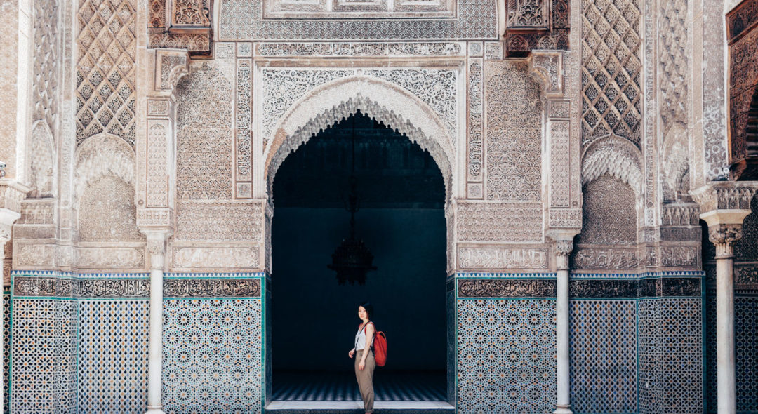 Woman tourist visiting old temple in Marrakech