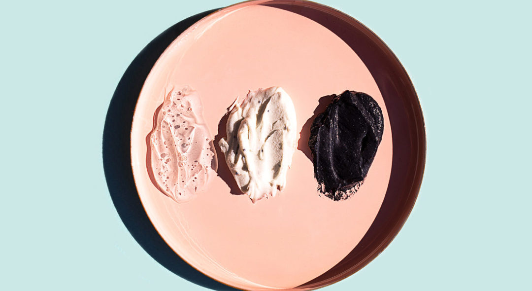 Scrub or beauty facial masks smears on pastel pink plate
