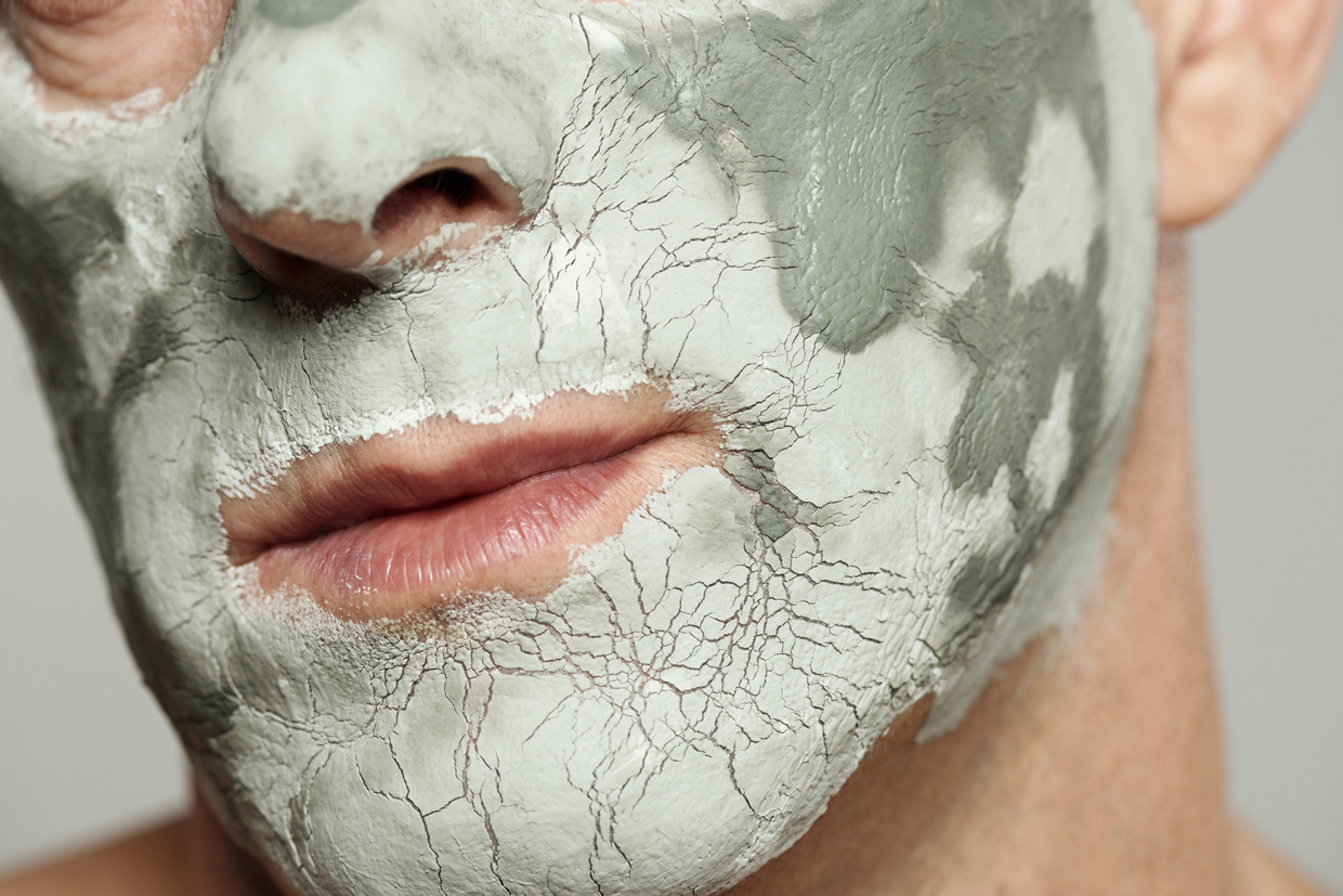 Unrecognizable Man With Clay Mask
