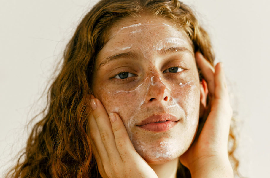 woman cleansing face