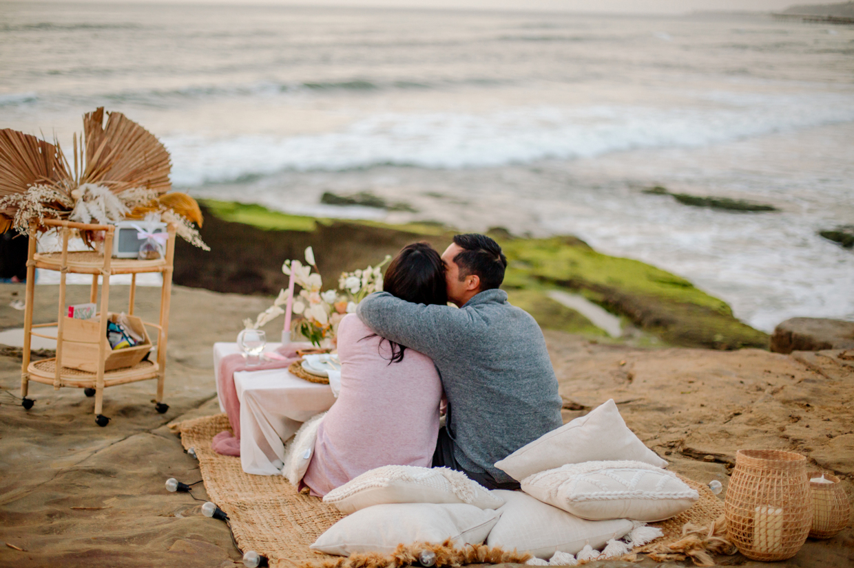 couple in a Romantic picnic overlooking ocean