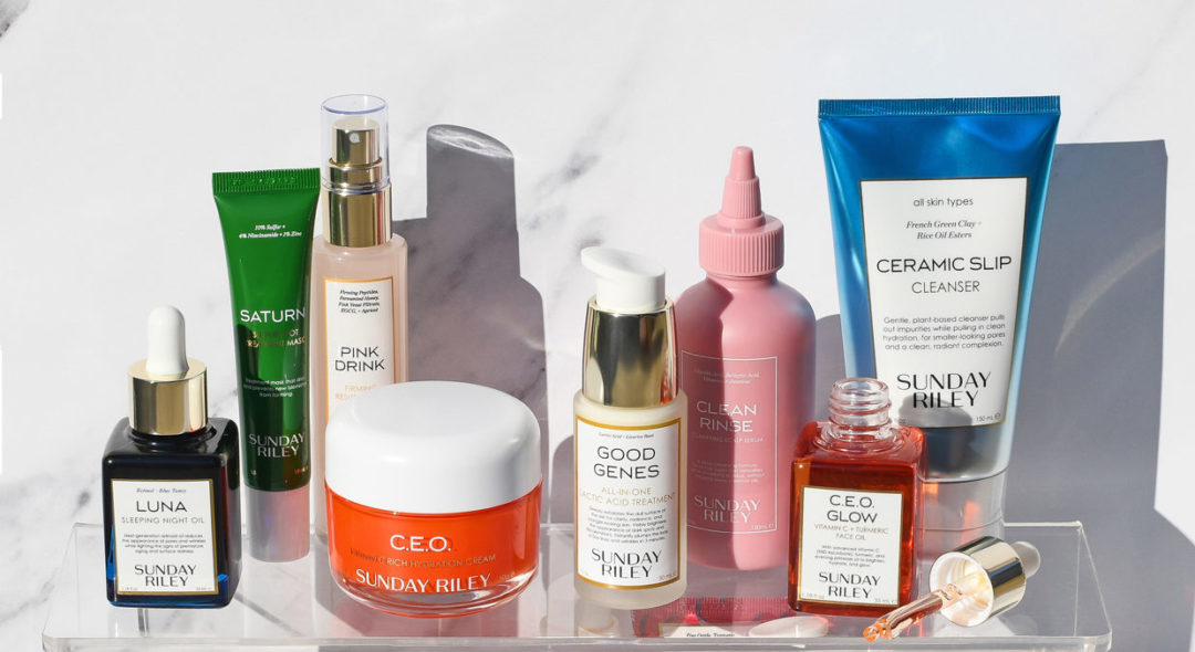 Still life of Sunday Riley products on glass shelf