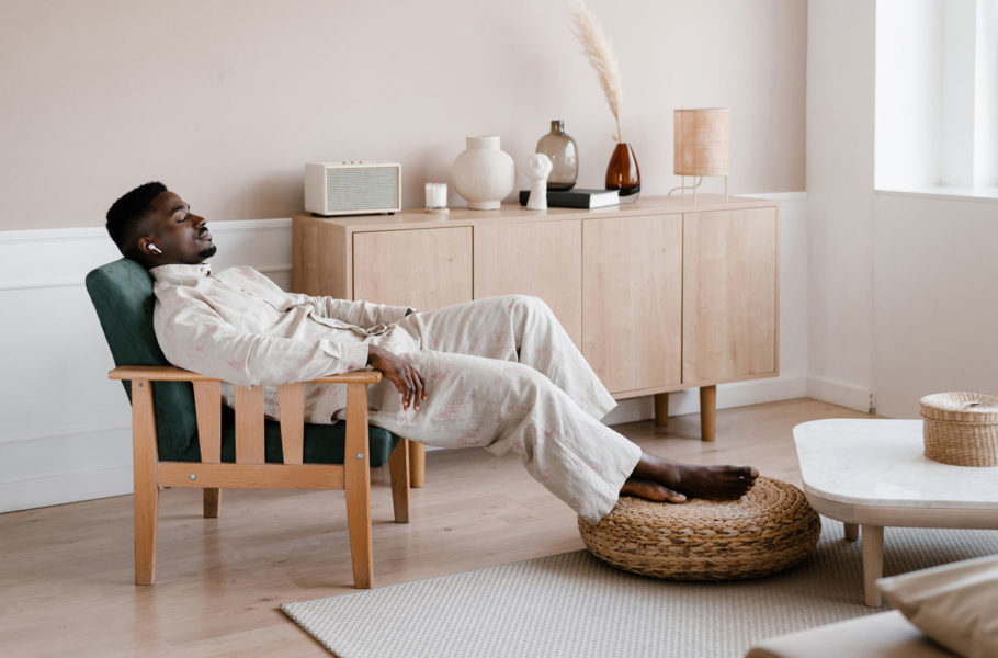 Relaxed man listening to music at home
