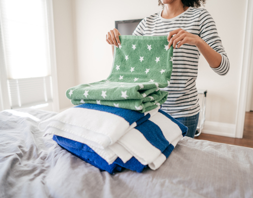 Woman folding towels