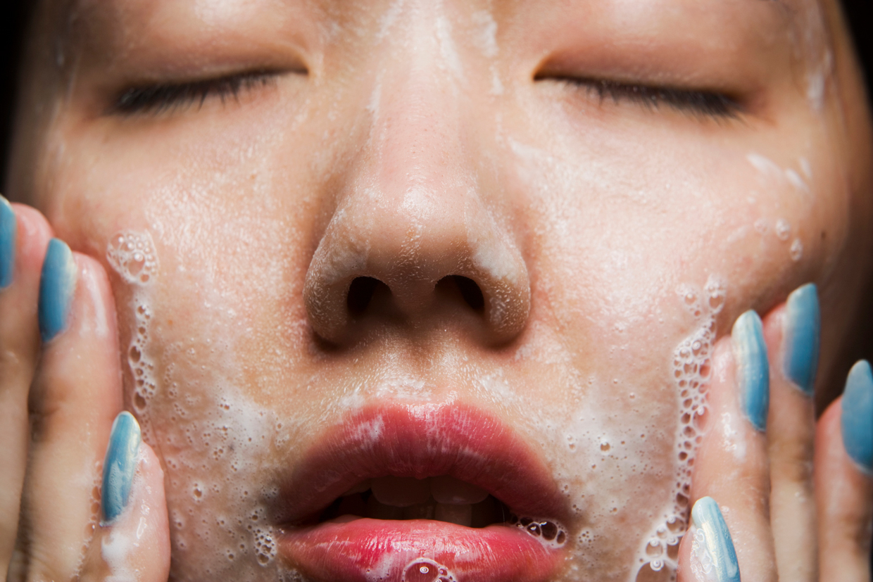 woman washing face, close-up