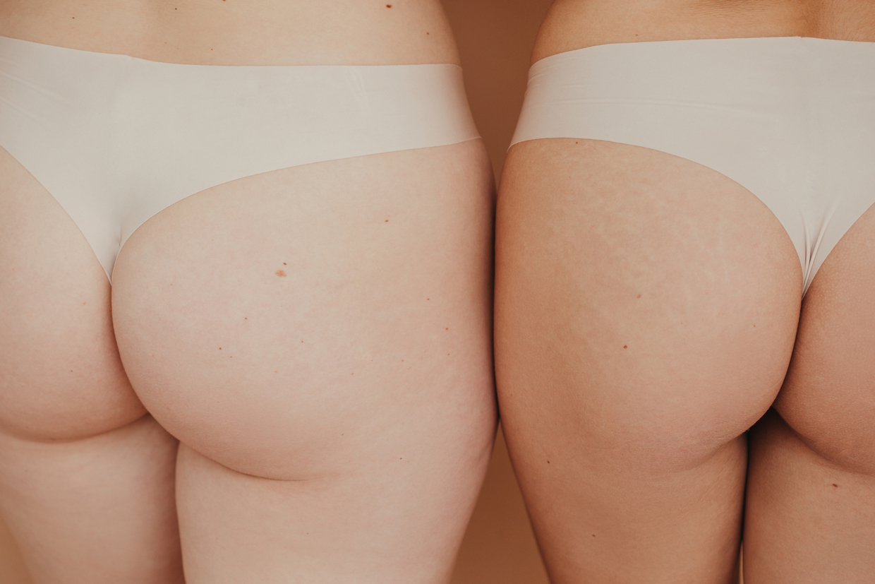 close up of two woman's butts