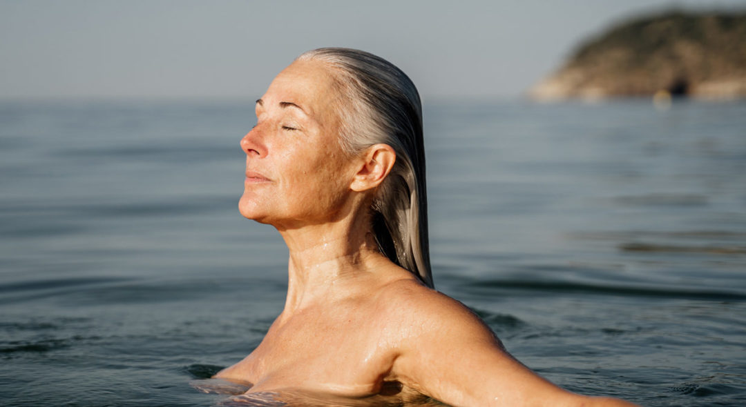 Portrait of a woman swimming in the sea