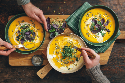 overhead shot of Creamy Roasted Pumpkin Soup Bowls