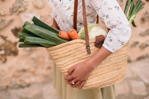 Locally sourced vegetables in straw bag