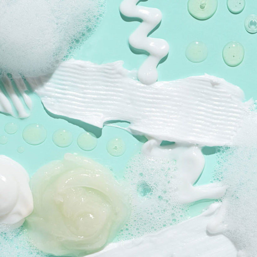 skincare products on blue background