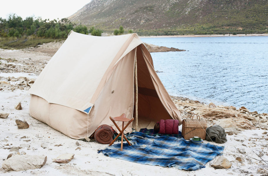tent set up near a lake