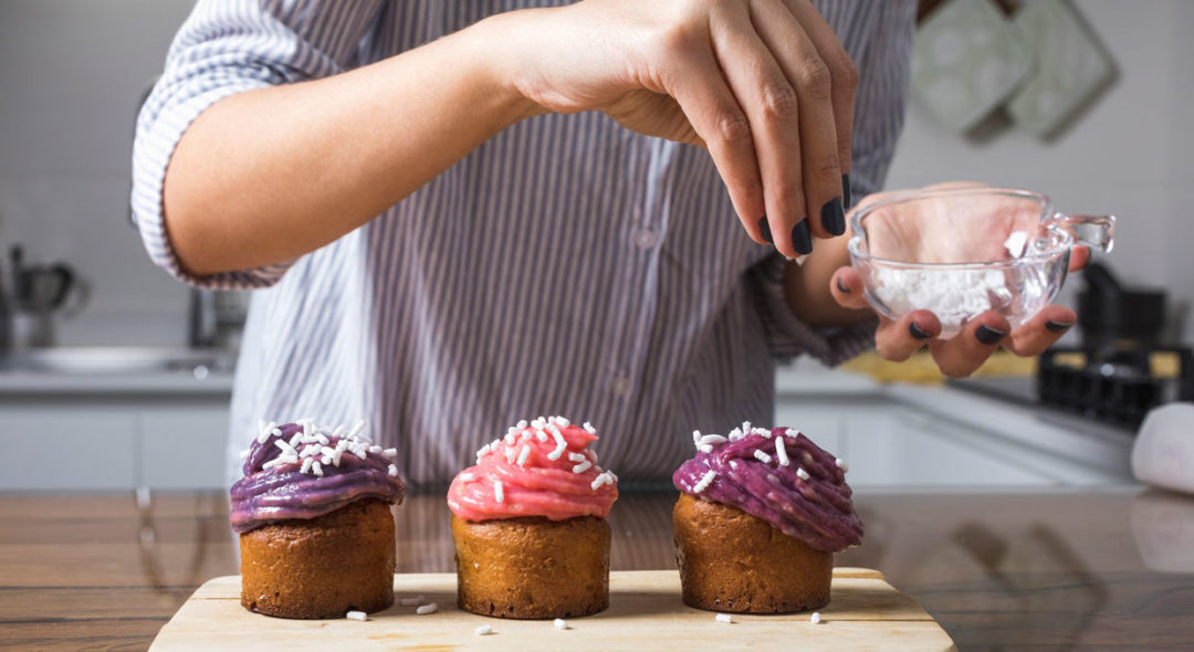 Woman preparing muffins at home