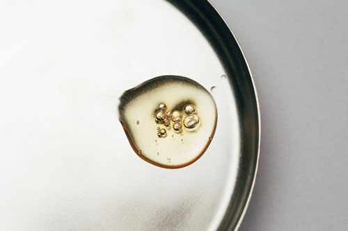 Drop of fragrant oil with bubbles