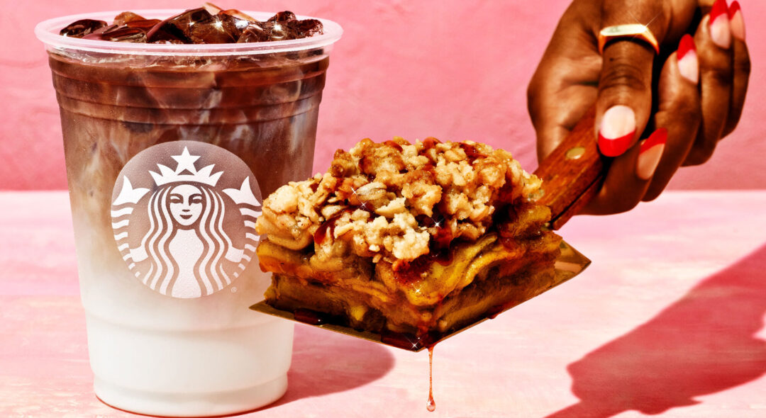 hand holding Starbucks pastry and iced beverages